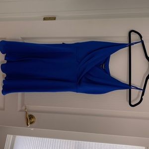 New with tags. Royal blue spaghetti strapped cocktail dress